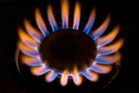 why are gas stove flames orange